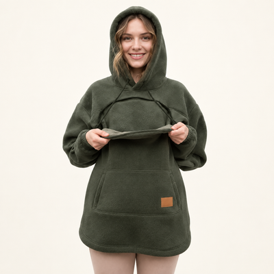Woman demonstrating the open front pouch of an olive fleece hoodie